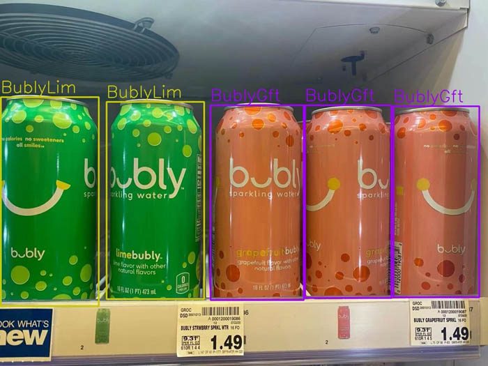 The image shows a vertical refrigerator shelf with 2 BublyLim green cans and 3 BublyGft orange cans.